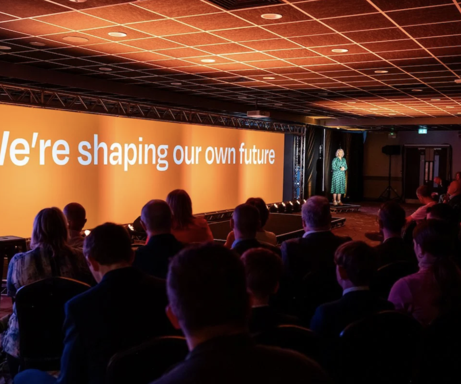 An audience looking at a presentation